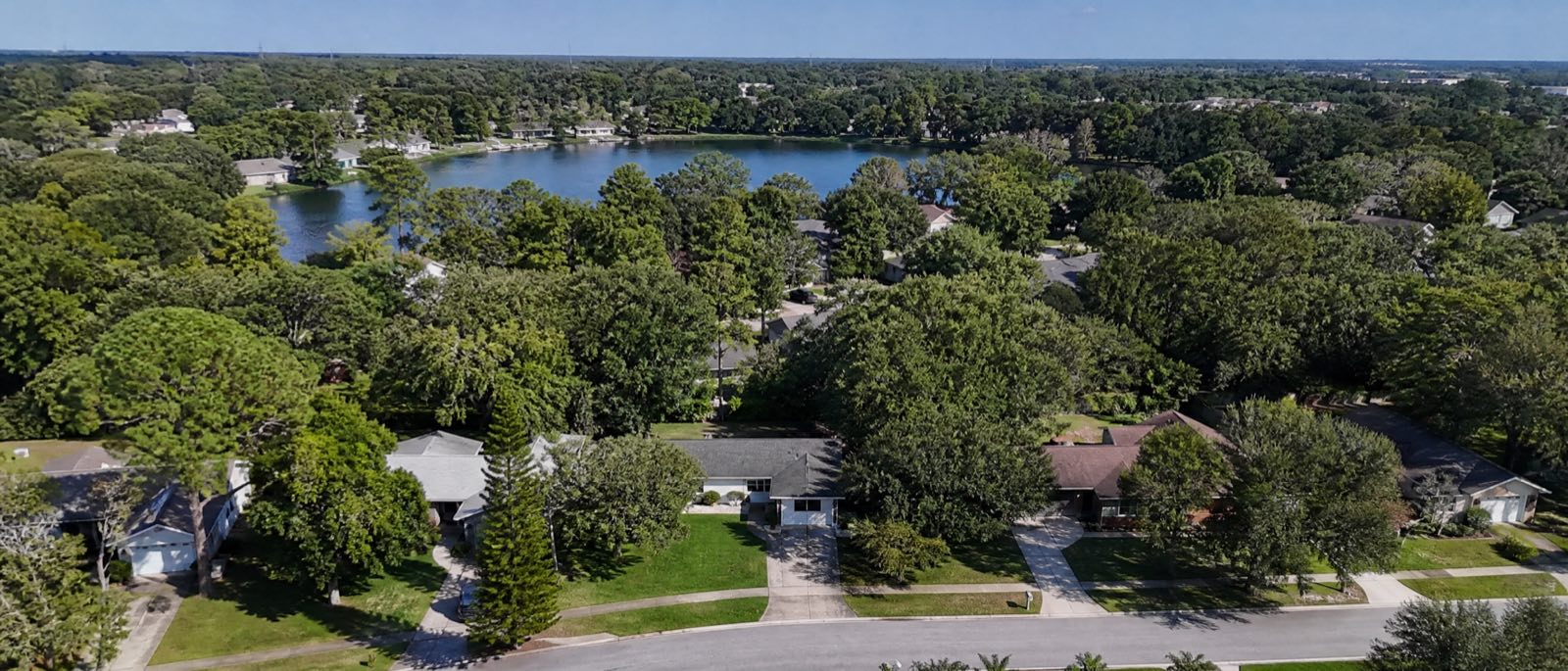 A low aerial view of Altamonte Springs, Florida, with residential driveways in the foreground