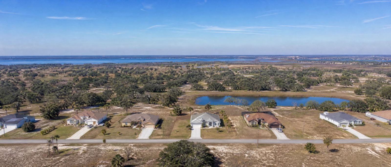A low aerial view of Kissimmee, Florida, with residential driveways in the foreground