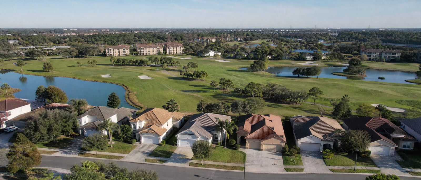 A low aerial view of Metrowest, Florida, with residential driveways in the foreground