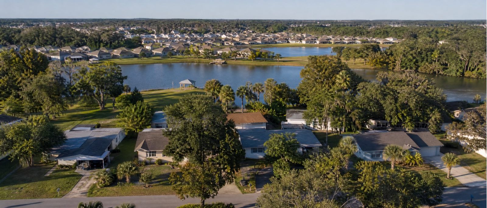 A low aerial view of Ocoee, Florida, with residential driveways in the foreground