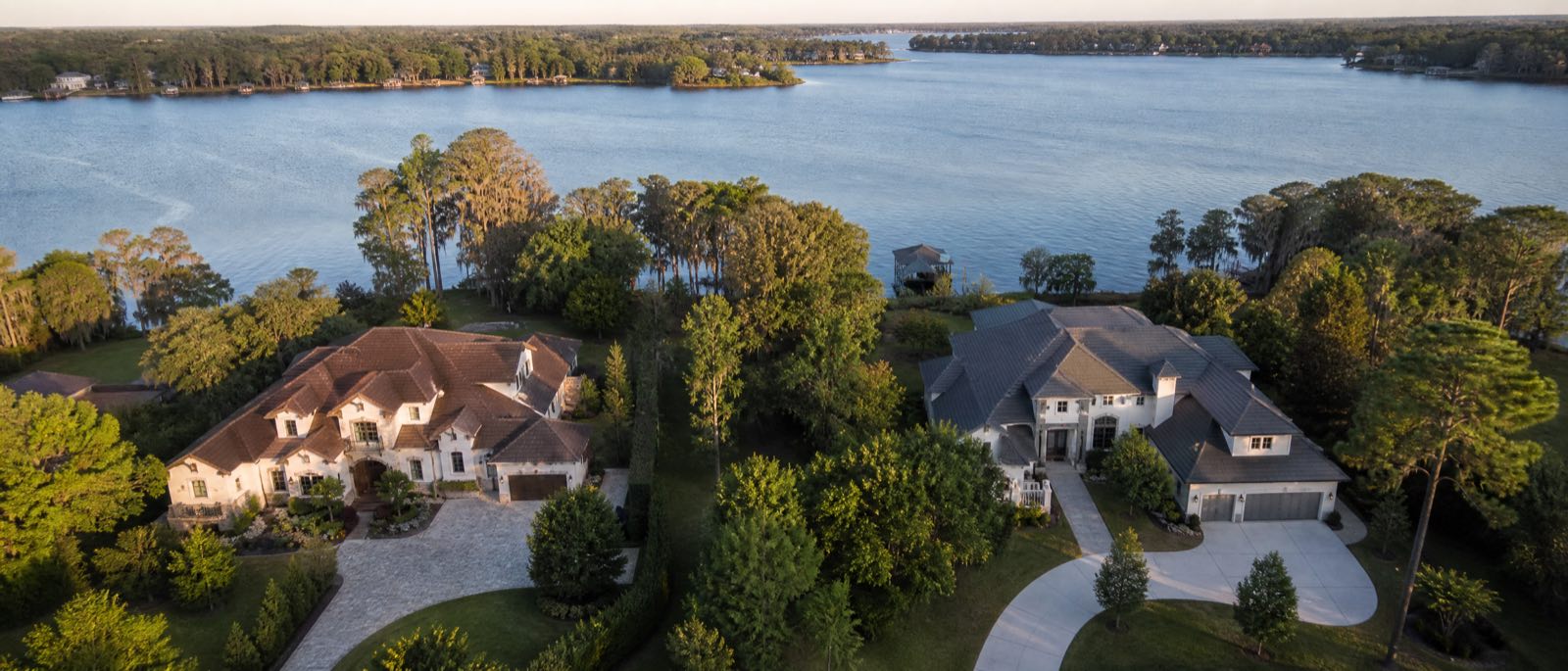 A low aerial view of Windermere, Florida, with residential driveways in the foreground
