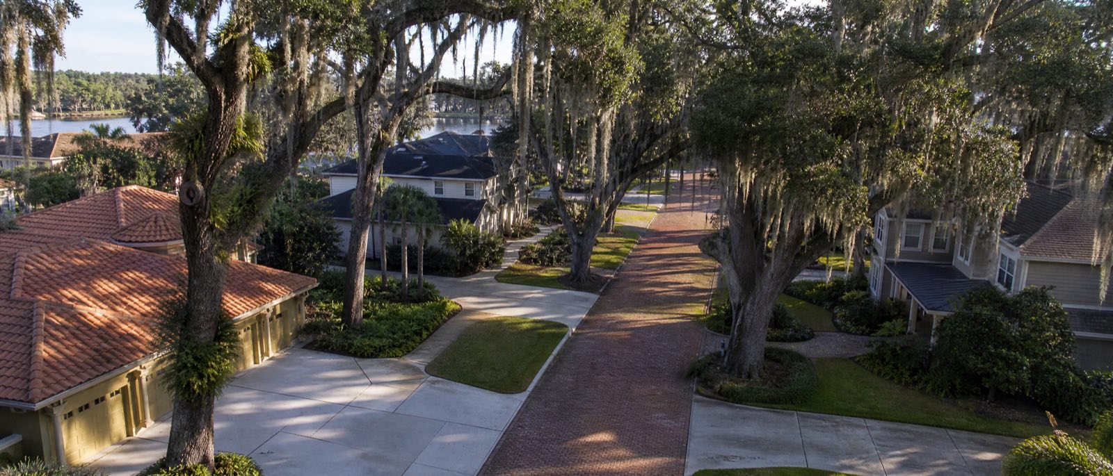 A low aerial view of Winter Park, Florida, with residential driveways in the foreground